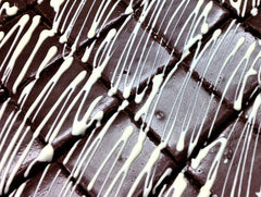 Chocolate Cheesecake Squares with White Drizzle